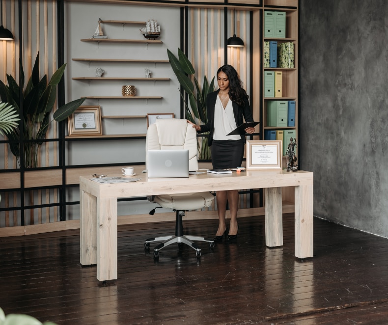 woman standing beside office chair (1).png